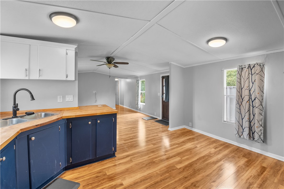 169 West Bagwell Road Liberty, SC 29657 - Photo 15 of 29 A streamlined open-concept living area with lustrous flooring, ideal for versatile layouts.
