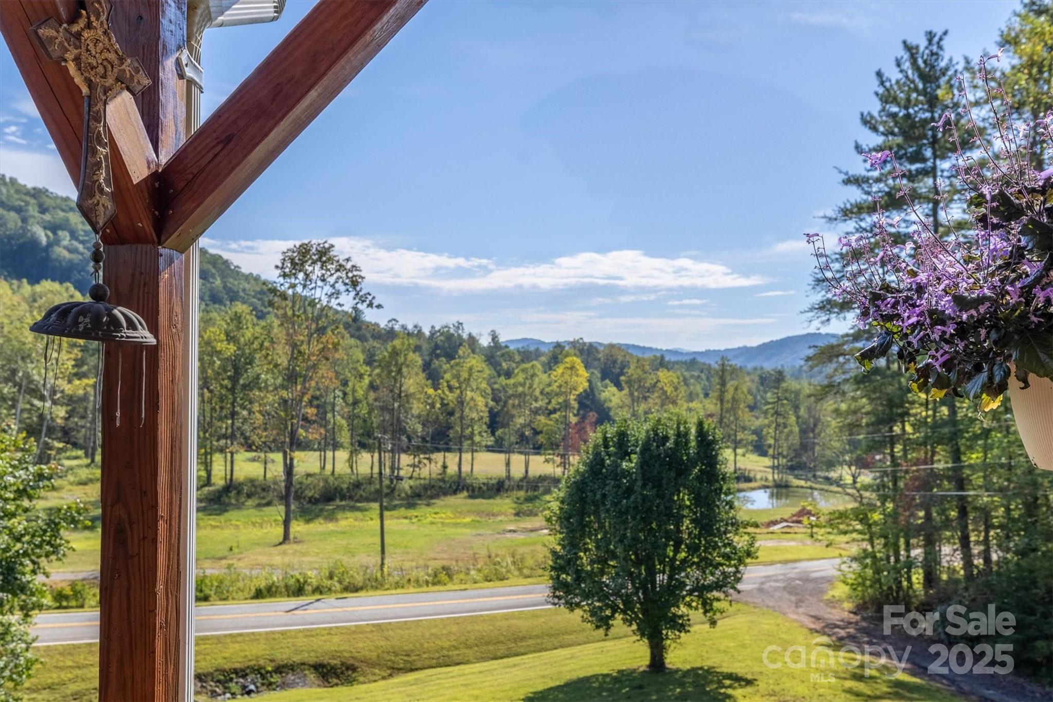 5933 Nubbin Creek Road Lenoir, NC 28645 - Photo 12 of 36 a view of a lake with a mountain in the background