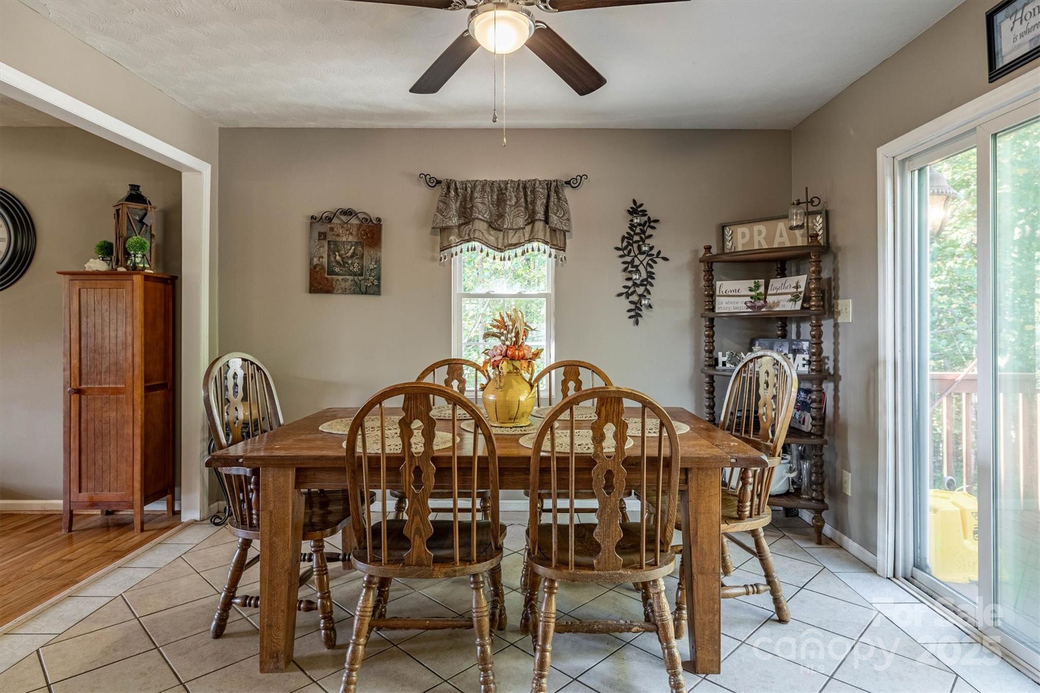 5933 Nubbin Creek Road Lenoir, NC 28645 - Photo 16 of 36 a view of a dining room with furniture and chandelier