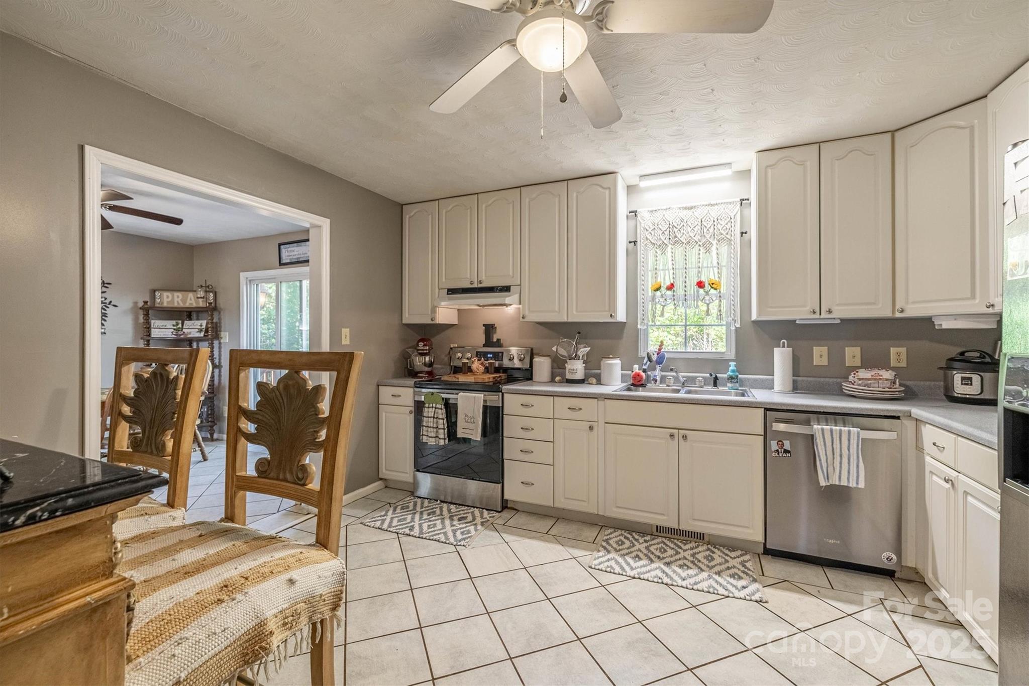 5933 Nubbin Creek Road Lenoir, NC 28645 - Photo 18 of 36 a kitchen with a sink cabinets and window