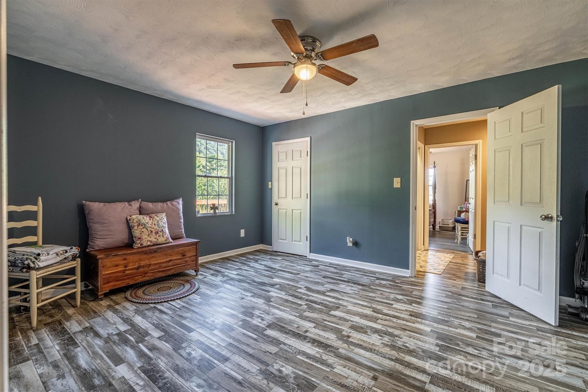 5933 Nubbin Creek Road Lenoir, NC 28645 - Photo 25 of 36 a living room with furniture and wooden floor