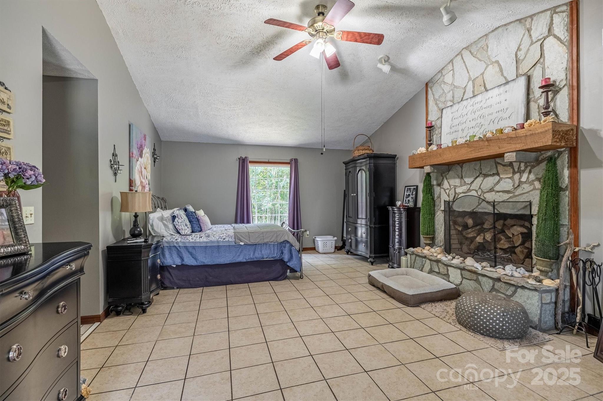 5933 Nubbin Creek Road Lenoir, NC 28645 - Photo 29 of 36 a living room with furniture a flat screen tv and a fireplace