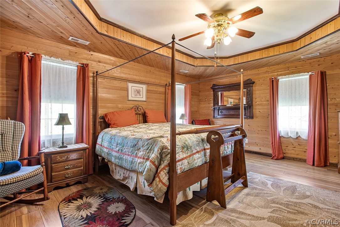 5011 Treely Road Chester, VA 23831 - Photo 13 of 50 a bedroom with a bed a chandelier and flat screen tv