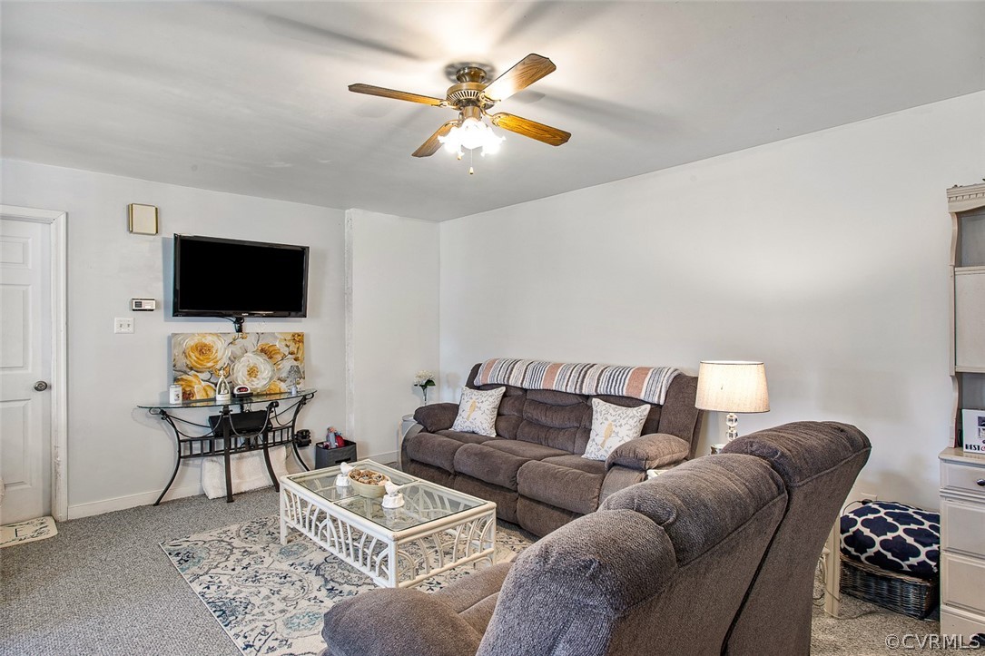 5011 Treely Road Chester, VA 23831 - Photo 26 of 50 a living room with furniture and a flat screen tv