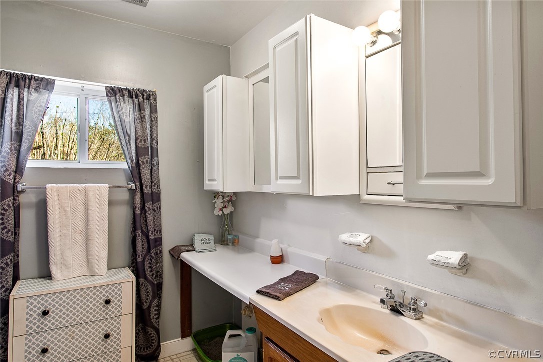 5011 Treely Road Chester, VA 23831 - Photo 32 of 50 a bathroom with a sink vanity and a mirror