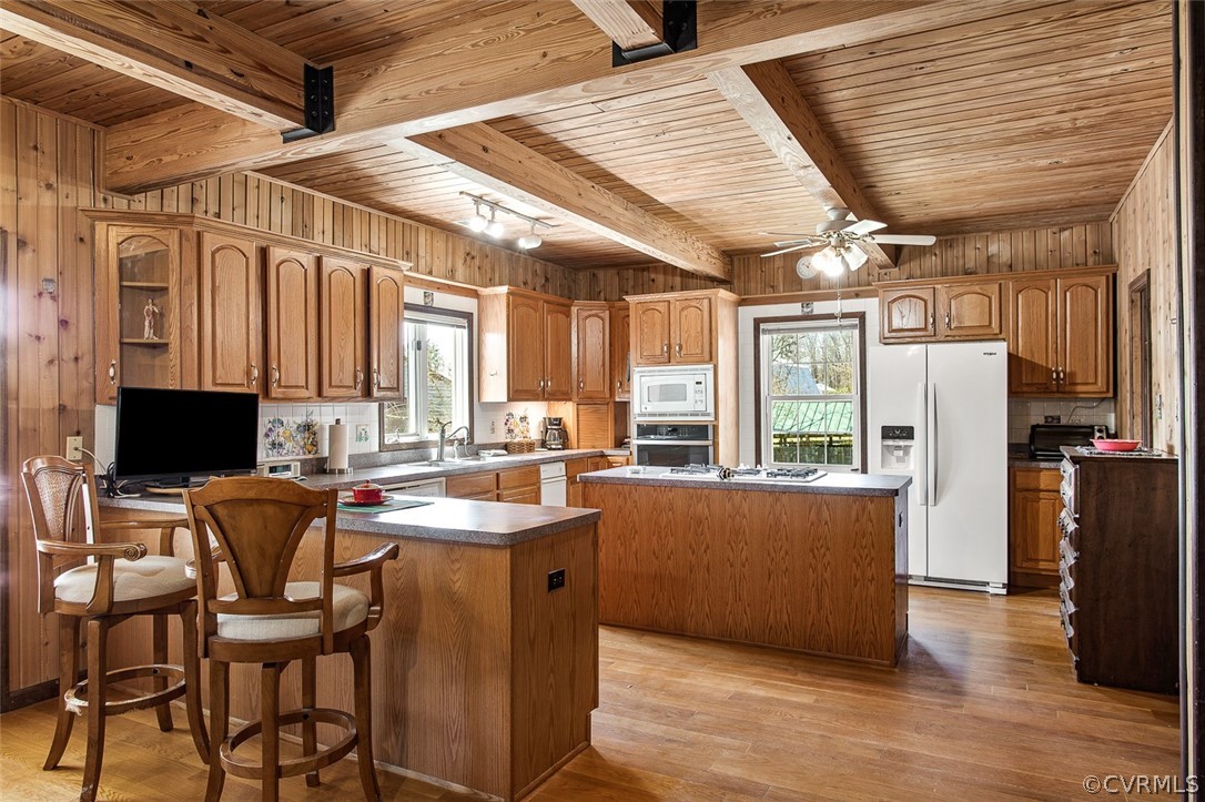 5011 Treely Road Chester, VA 23831 - Photo 7 of 50 a kitchen with stainless steel appliances kitchen island granite countertop a table chairs and a refrigerator