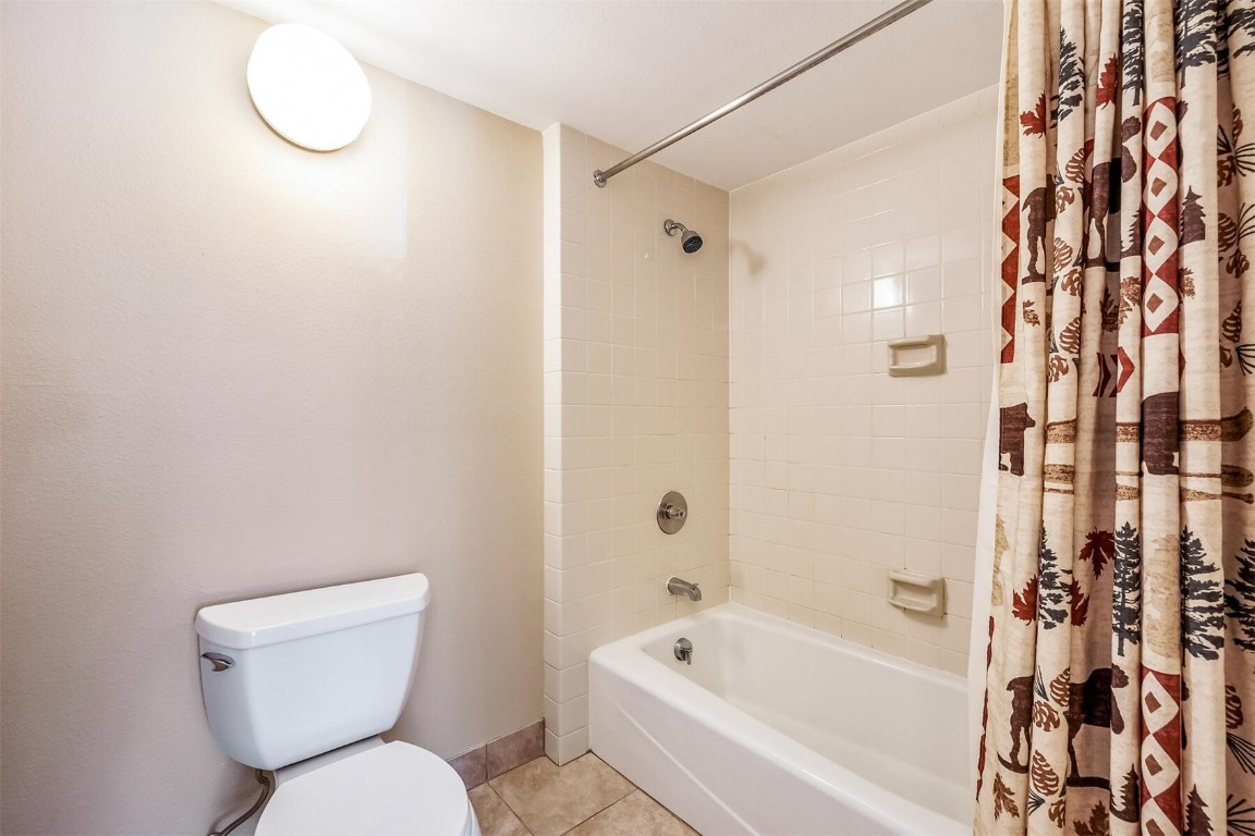 21630 Highway 6, Unit 2149 Keystone, CO 80435 - Photo 17 of 35 a white toilet sitting next to a bath tub