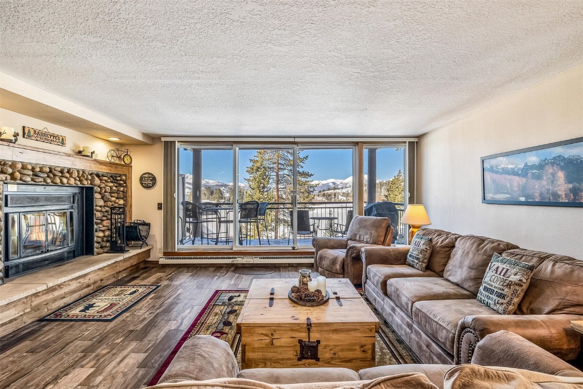 21630 Highway 6, Unit 2149 Keystone, CO 80435 - Photo 4 of 35 a living room with furniture and a fireplace