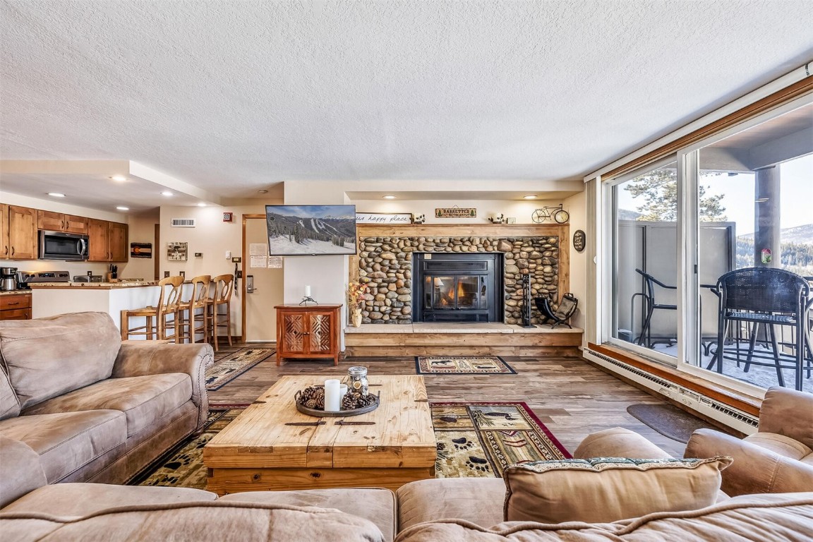 21630 Highway 6, Unit 2149 Keystone, CO 80435 - Photo 5 of 35 a living room with furniture and a fireplace