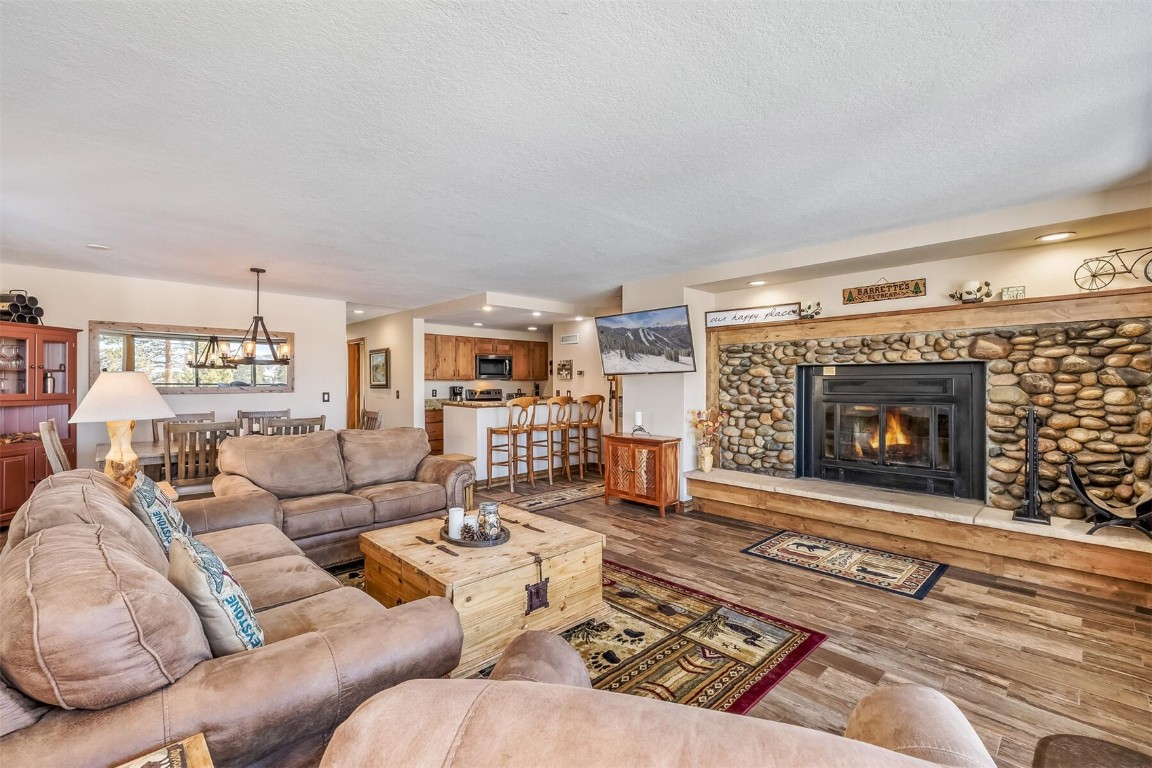 21630 Highway 6, Unit 2149 Keystone, CO 80435 - Photo 7 of 35 a living room with furniture and a fireplace