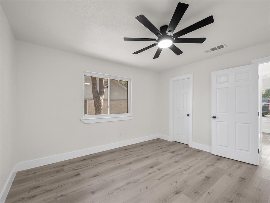 2127 Wheaton Drive Richardson, TX 75081 - Photo 21 of 33 a view of empty room with wooden floor