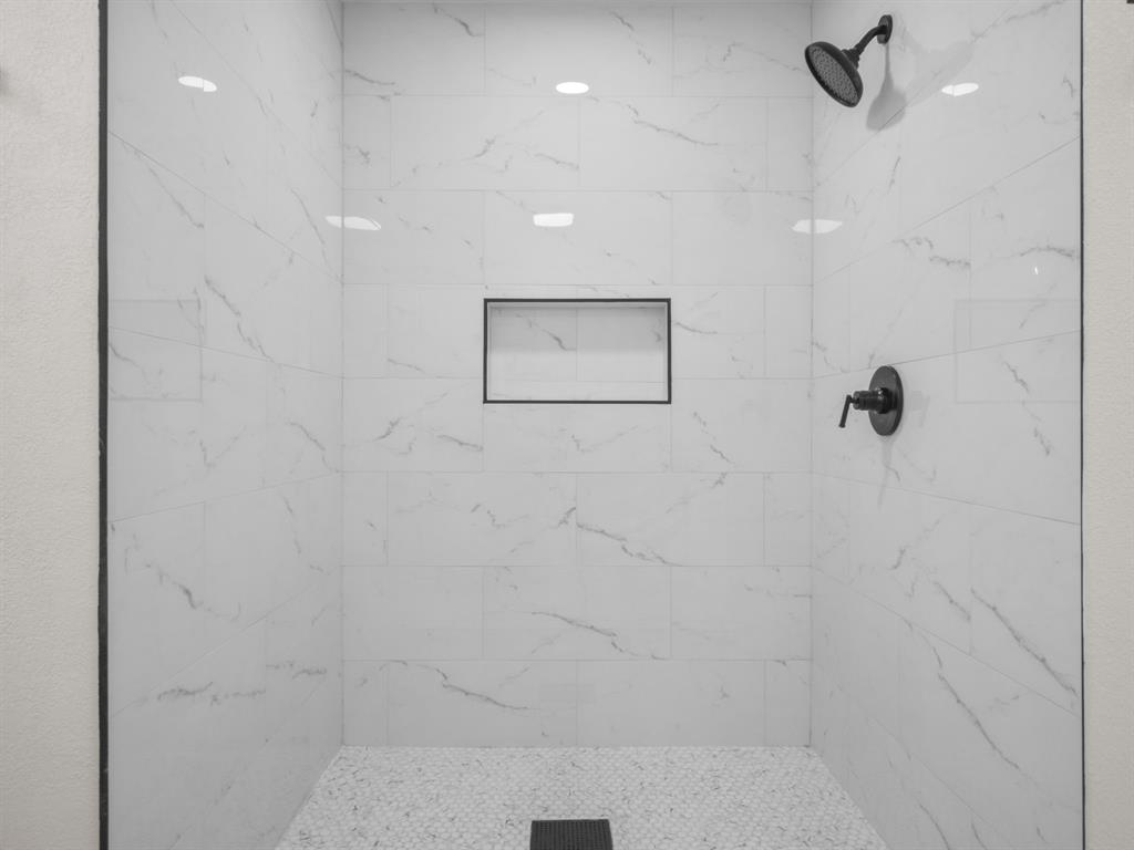 2127 Wheaton Drive Richardson, TX 75081 - Photo 23 of 33 a bathroom with a shower