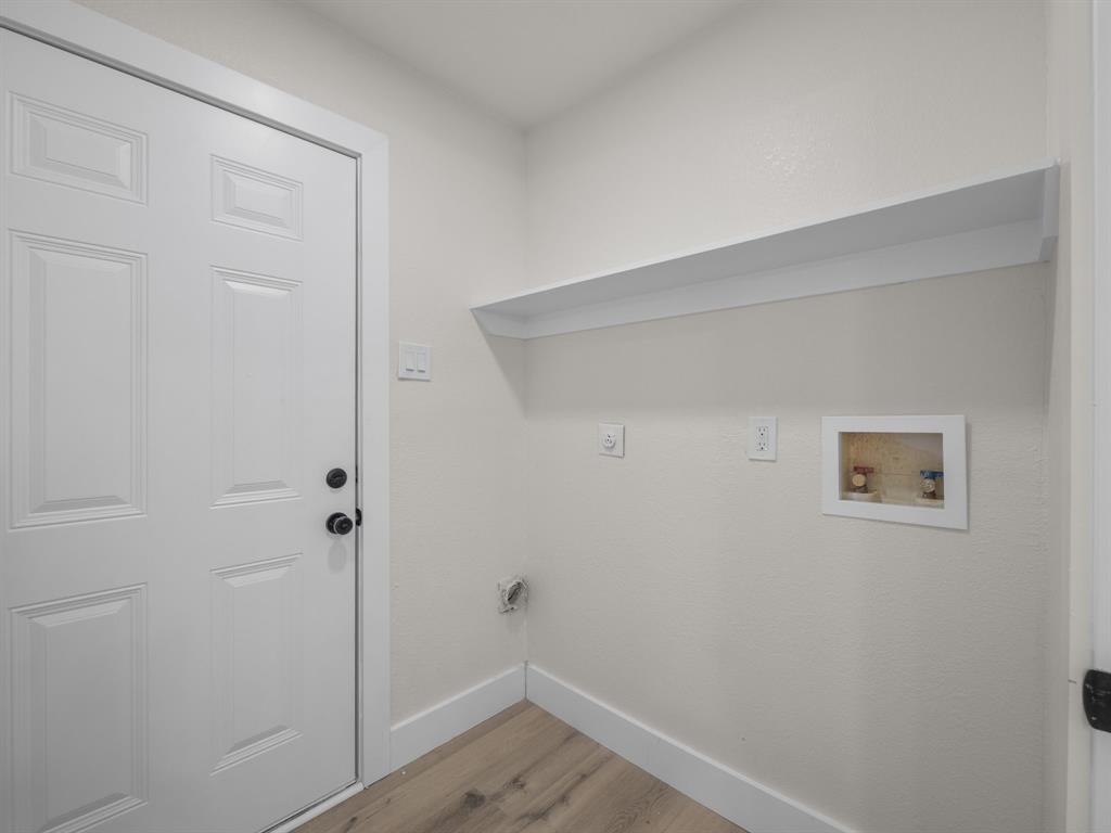 2127 Wheaton Drive Richardson, TX 75081 - Photo 28 of 33 a view of small space with wooden floor