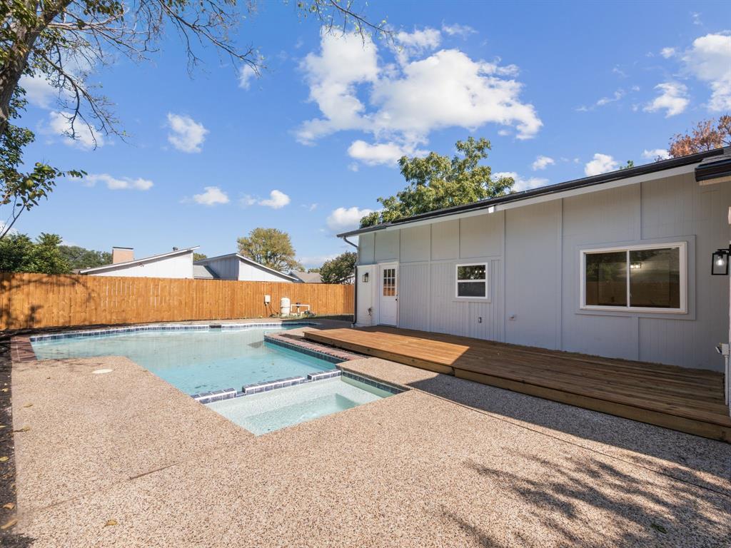 2127 Wheaton Drive Richardson, TX 75081 - Photo 31 of 33 a front view of a house with a yard and garage