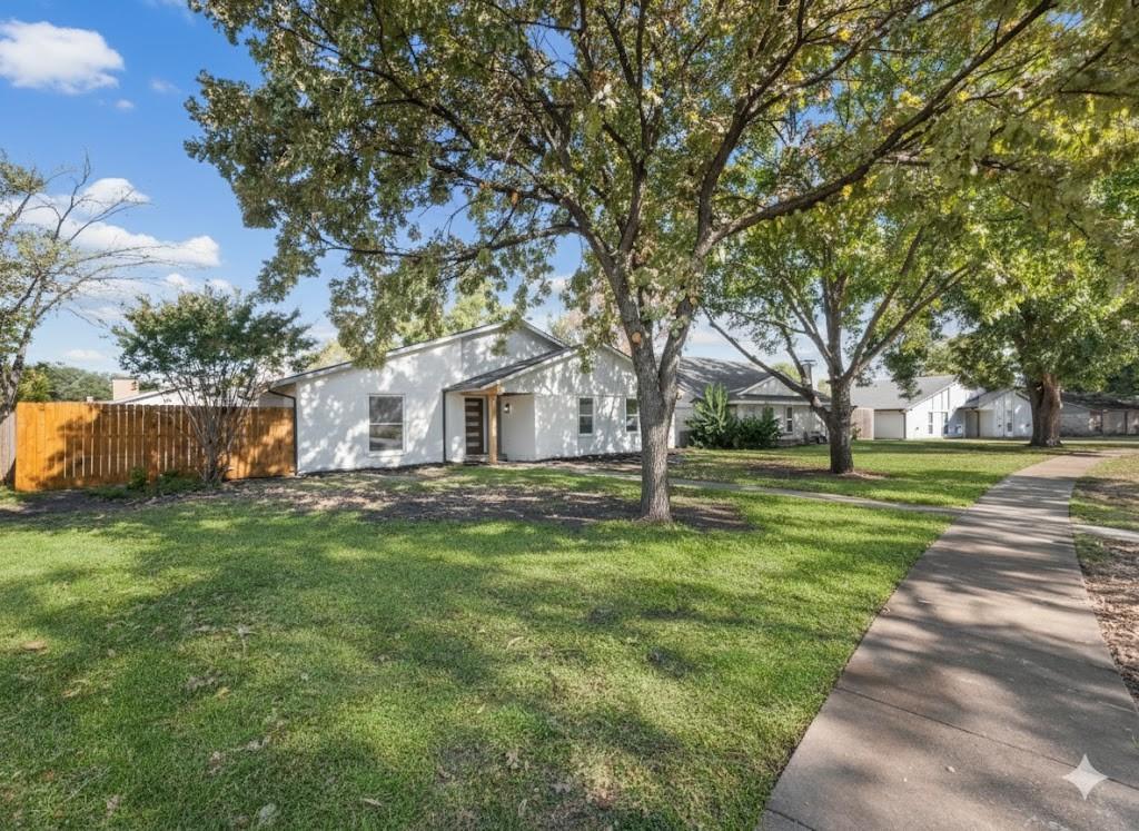 2127 Wheaton Drive Richardson, TX 75081 - Photo 4 of 33 a view of a house with a yard