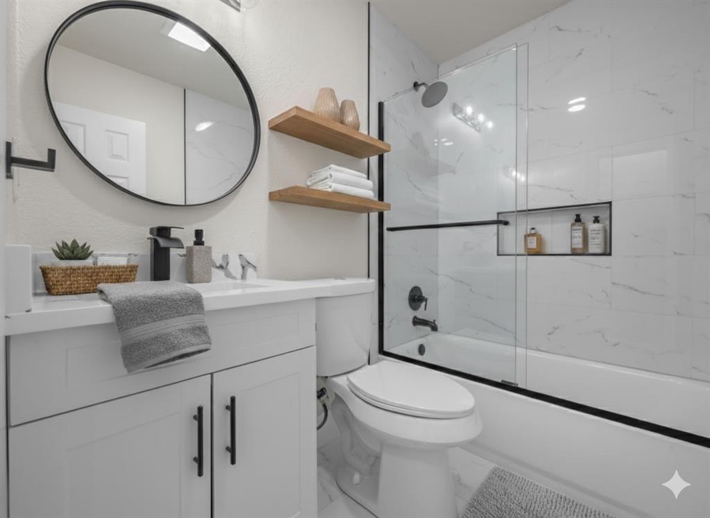 2127 Wheaton Drive Richardson, TX 75081 - Photo 7 of 33 a bathroom with a sink a toilet and a mirror