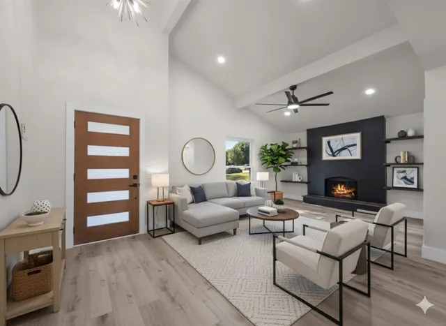 a living room with furniture a rug and a fireplace