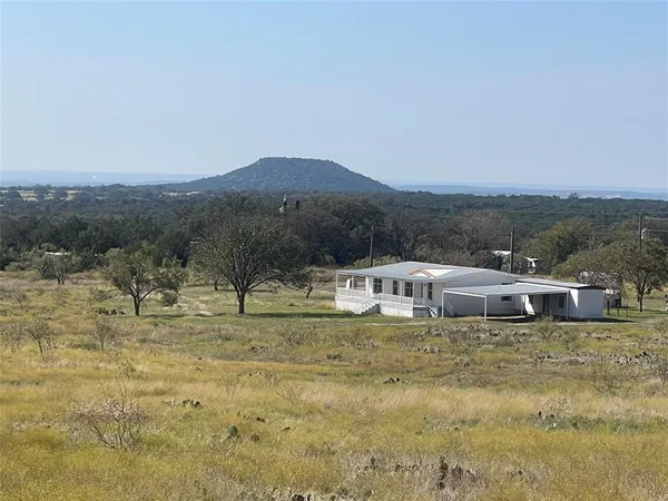 a view of a town with mountains in the background