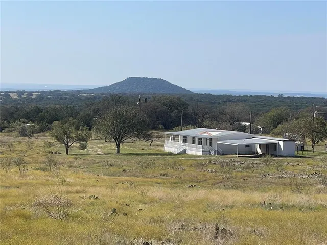 a view of a town with mountains in the background