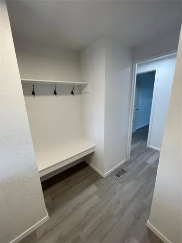 a view of room with wooden floor