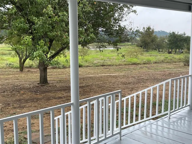 a view of a porch with a yard