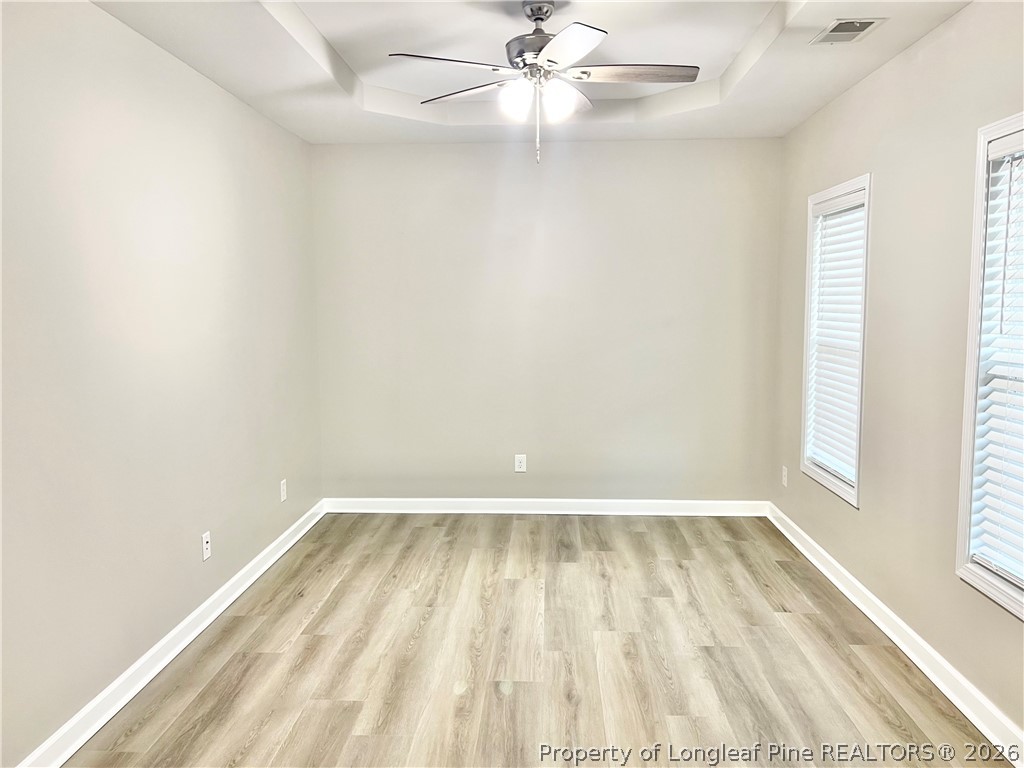 1523 Rough Rider Lane Parkton, NC 28371 - Photo 8 of 42 an empty room with a window and a fan