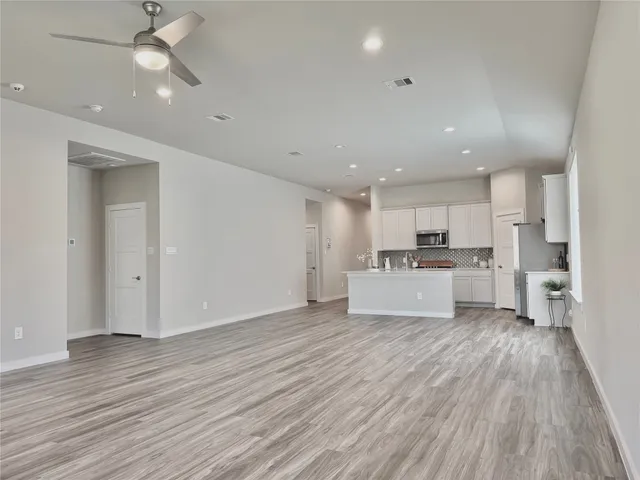 a view of kitchen with wooden floor