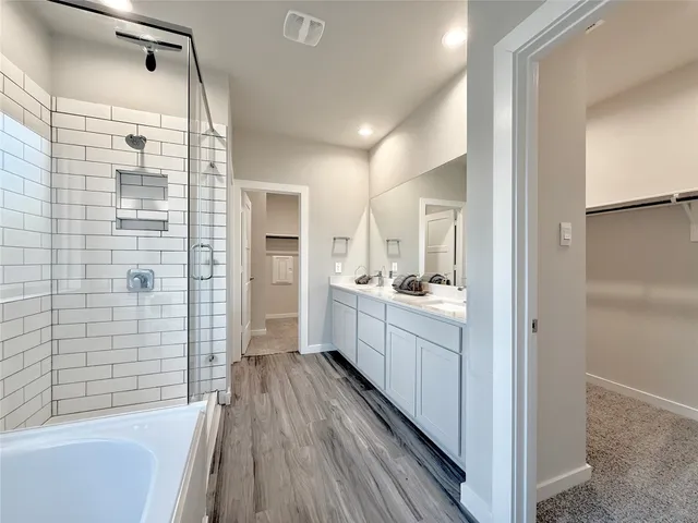 a bathroom with a sink a mirror and a bathtub