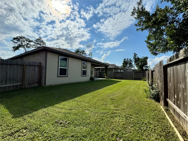 a backyard of a house with lots of green space