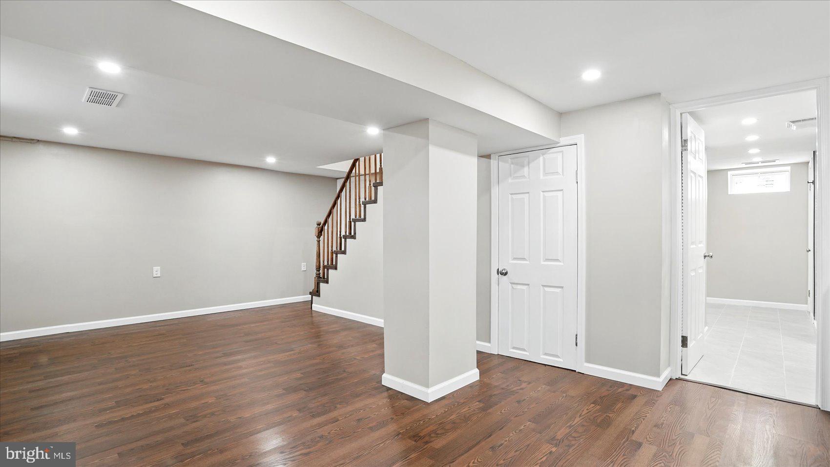 5427 Gradin Avenue Gwynn Oak, MD 21207 - Photo 15 of 24 an empty room with wooden floor and entryway