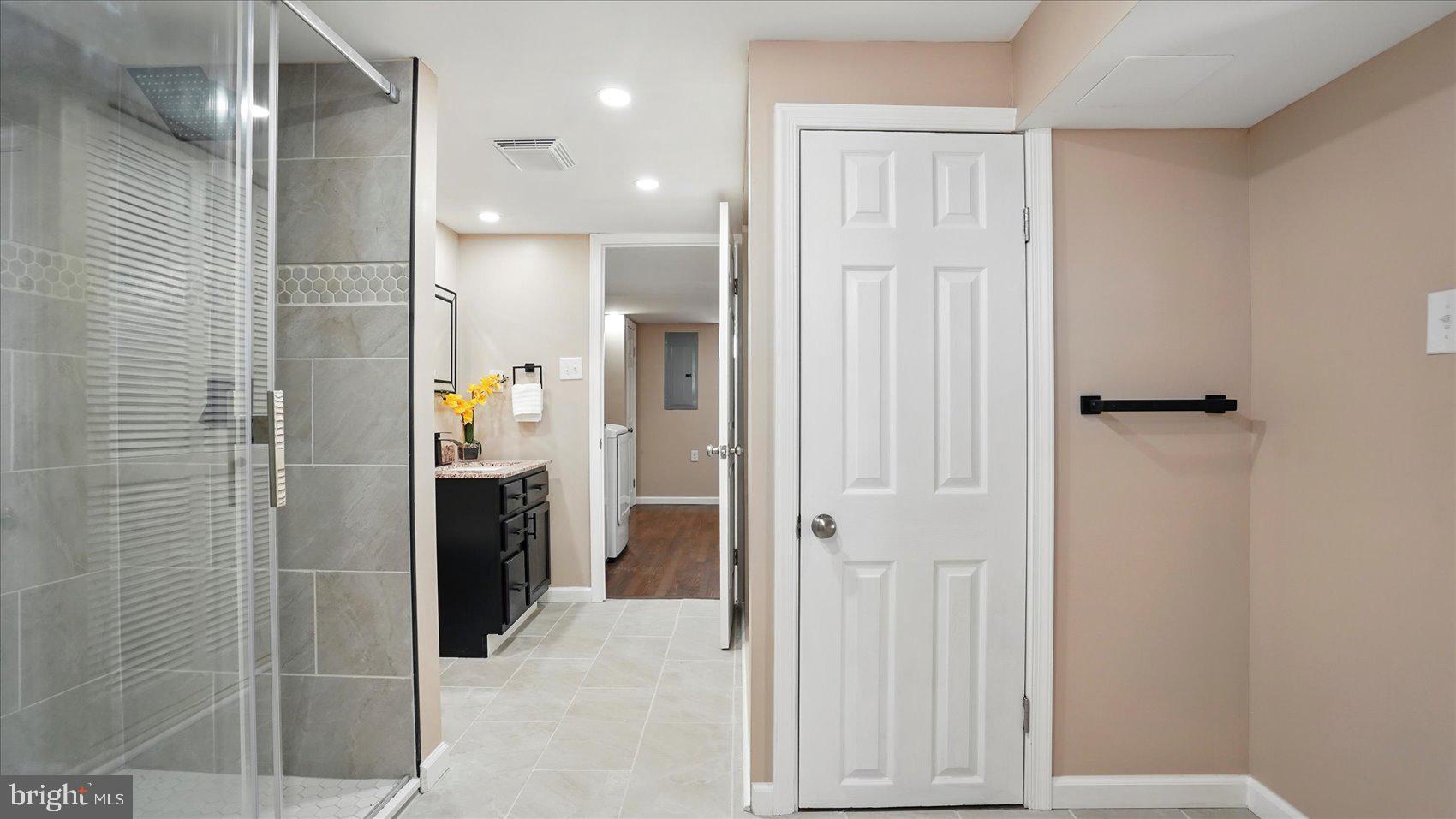 5427 Gradin Avenue Gwynn Oak, MD 21207 - Photo 17 of 24 a bathroom with a shower and a sink