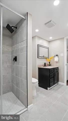 a bathroom with a shower and a sink