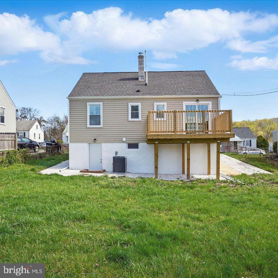 5427 Gradin Avenue Gwynn Oak, MD 21207 - Photo 22 of 24 a front view of a house with a yard