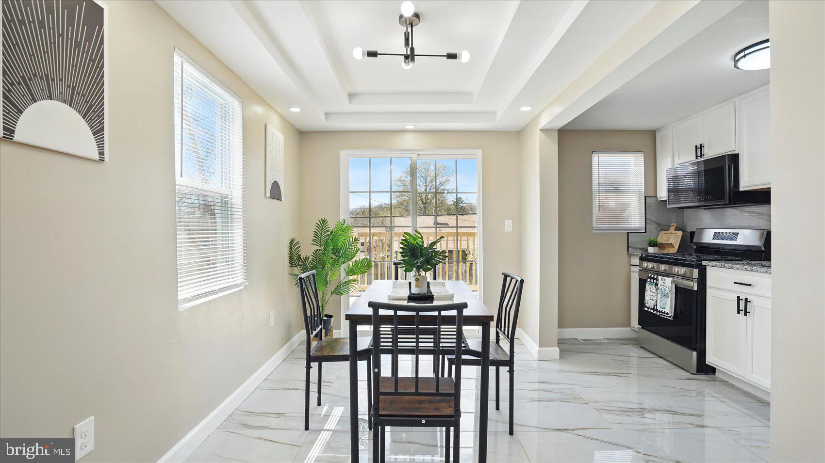 5427 Gradin Avenue Gwynn Oak, MD 21207 - Photo 3 of 24 a dining room with furniture and window