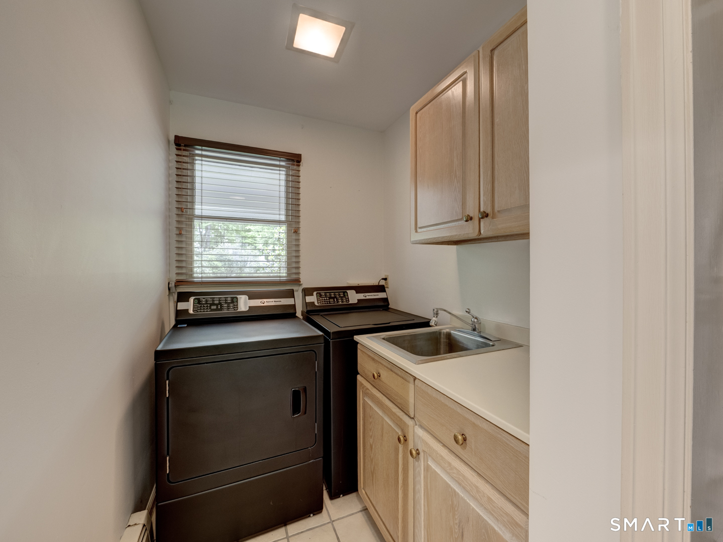 78 Windtree Street Torrington, CT 06790 - Photo 25 of 40 a view of a kitchen with a sink and cabinets