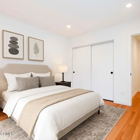 a bedroom with a bed and a table