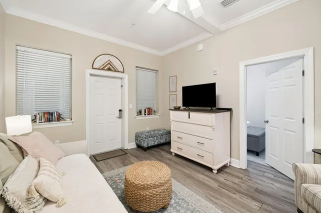 a view of a livingroom with furniture and a flat screen tv