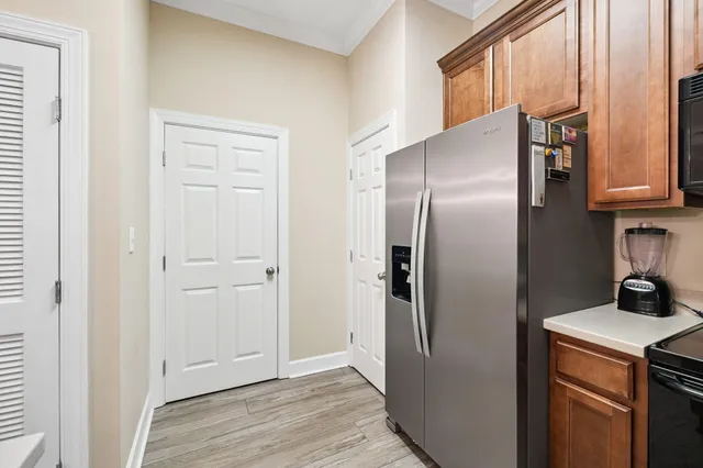 a kitchen with metallic refrigerator freezer and a dishwasher