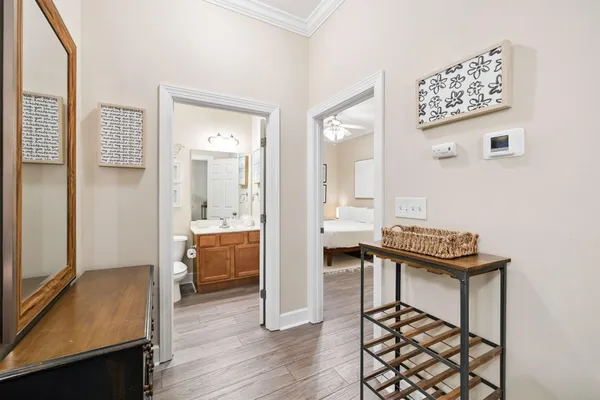 a view of a hallway with workspace and a mirror