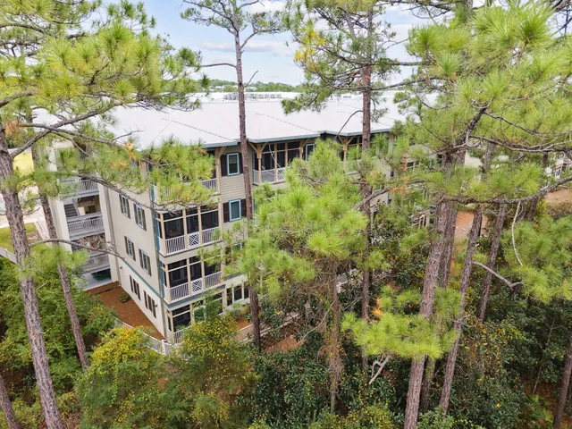 a view of a multi story building with a yard