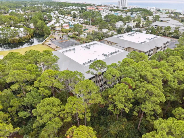 an aerial view of a house with a swimming pool