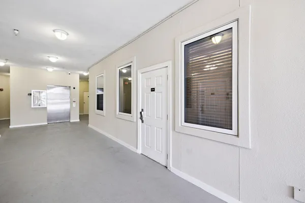 a view of a hallway with a bathroom