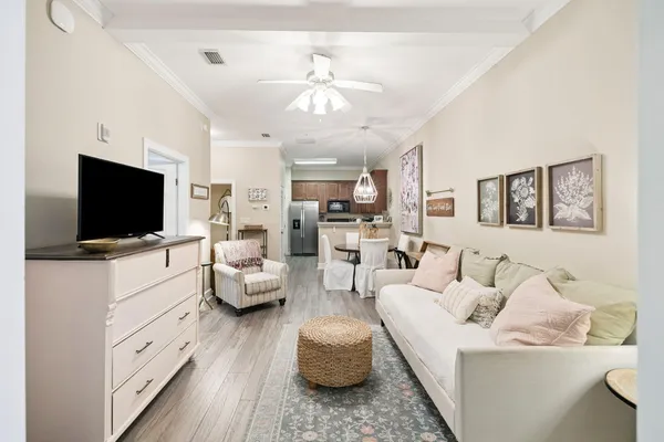 a living room with furniture and a flat screen tv
