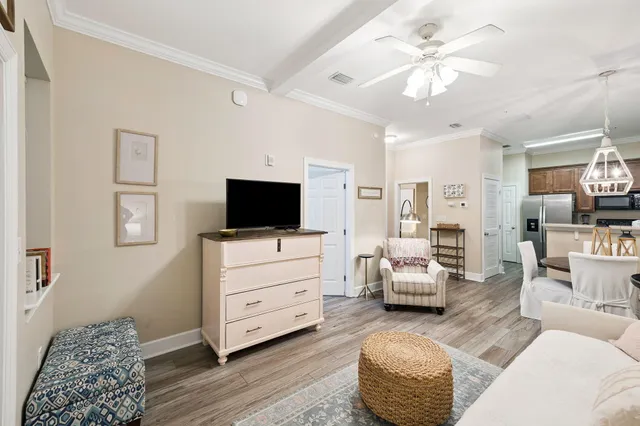 a bedroom with furniture and a flat screen tv