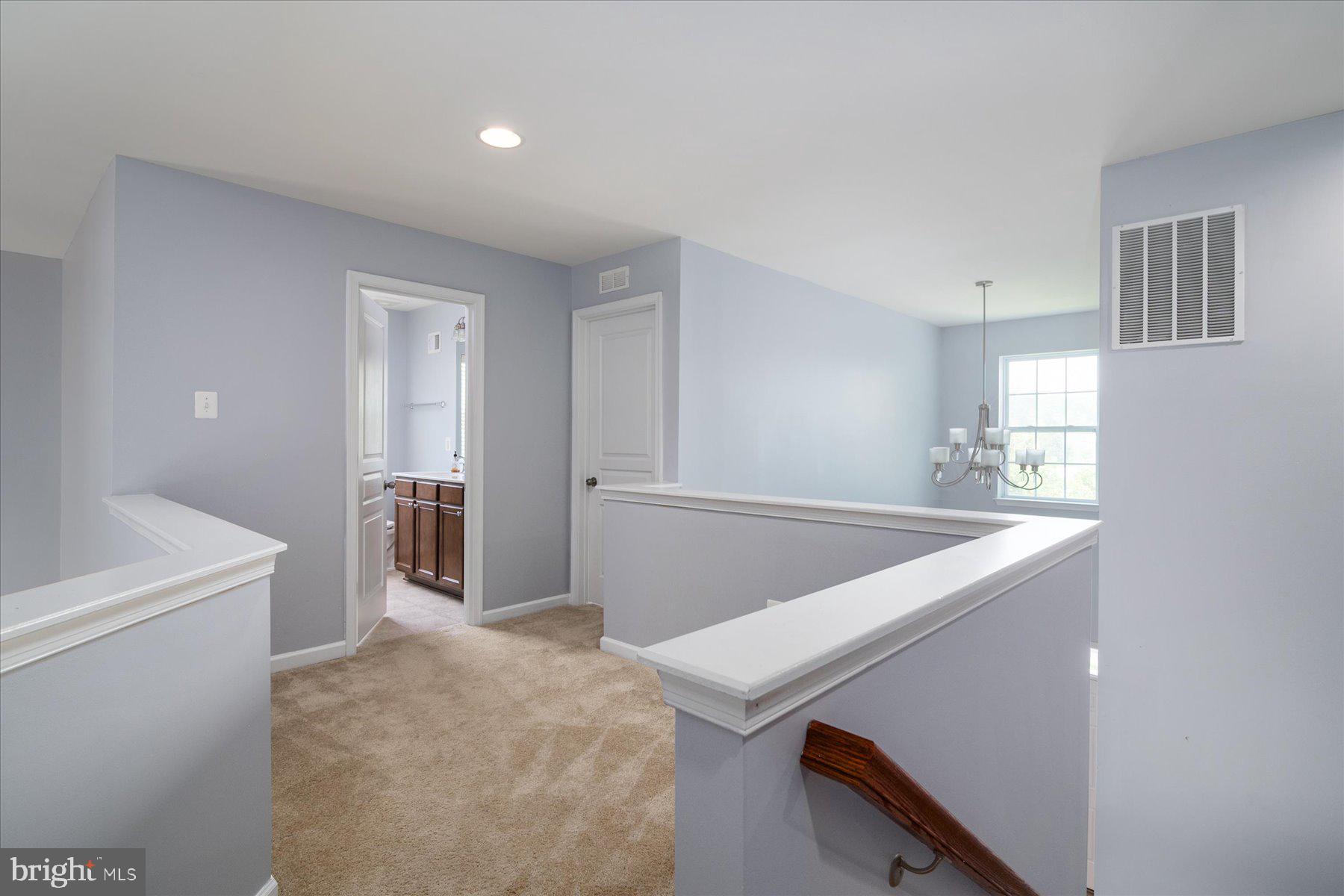 1411 Winter Pine Trail Severn, MD 21144 - Photo 30 of 53 Upstairs Hallway 2 stairwells font & back of home