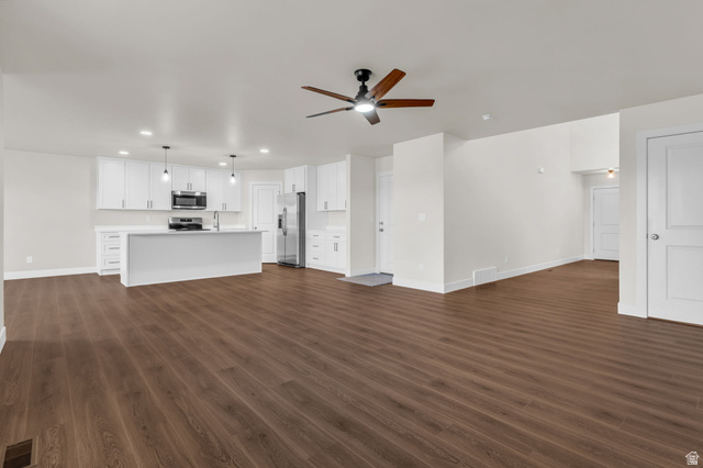 578 West 7th Midvale, UT 84047 - Photo 4 of 35 Unfurnished living room with recessed lighting, ceiling fan, and dark wood-style flooring