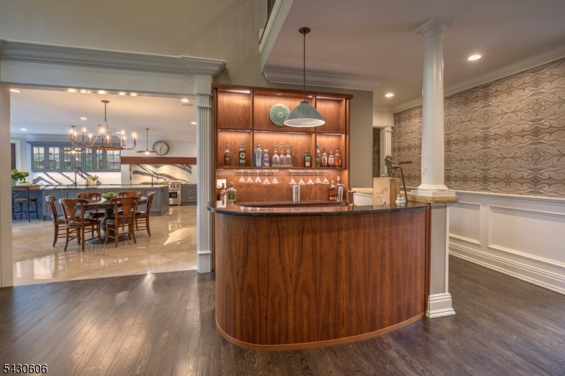 5 Burnett Road Mendham, NJ 07945 - Photo 7 of 50 a room with wooden floors table and chairs
