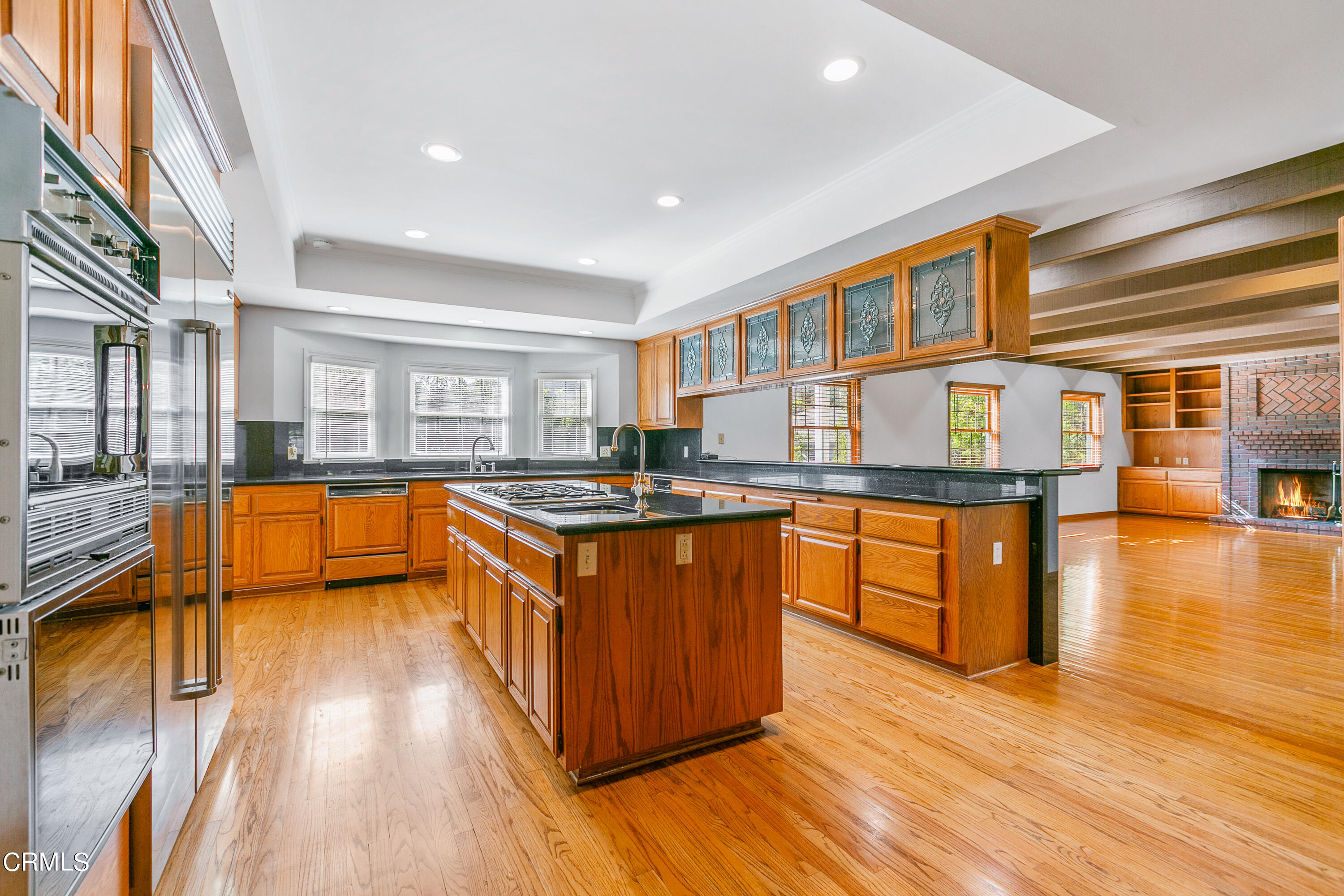800 Greenridge Drive La Canada Flintridge, CA 91011 - Photo 13 of 58 a large kitchen with stainless steel appliances granite countertop a large counter top and a stove