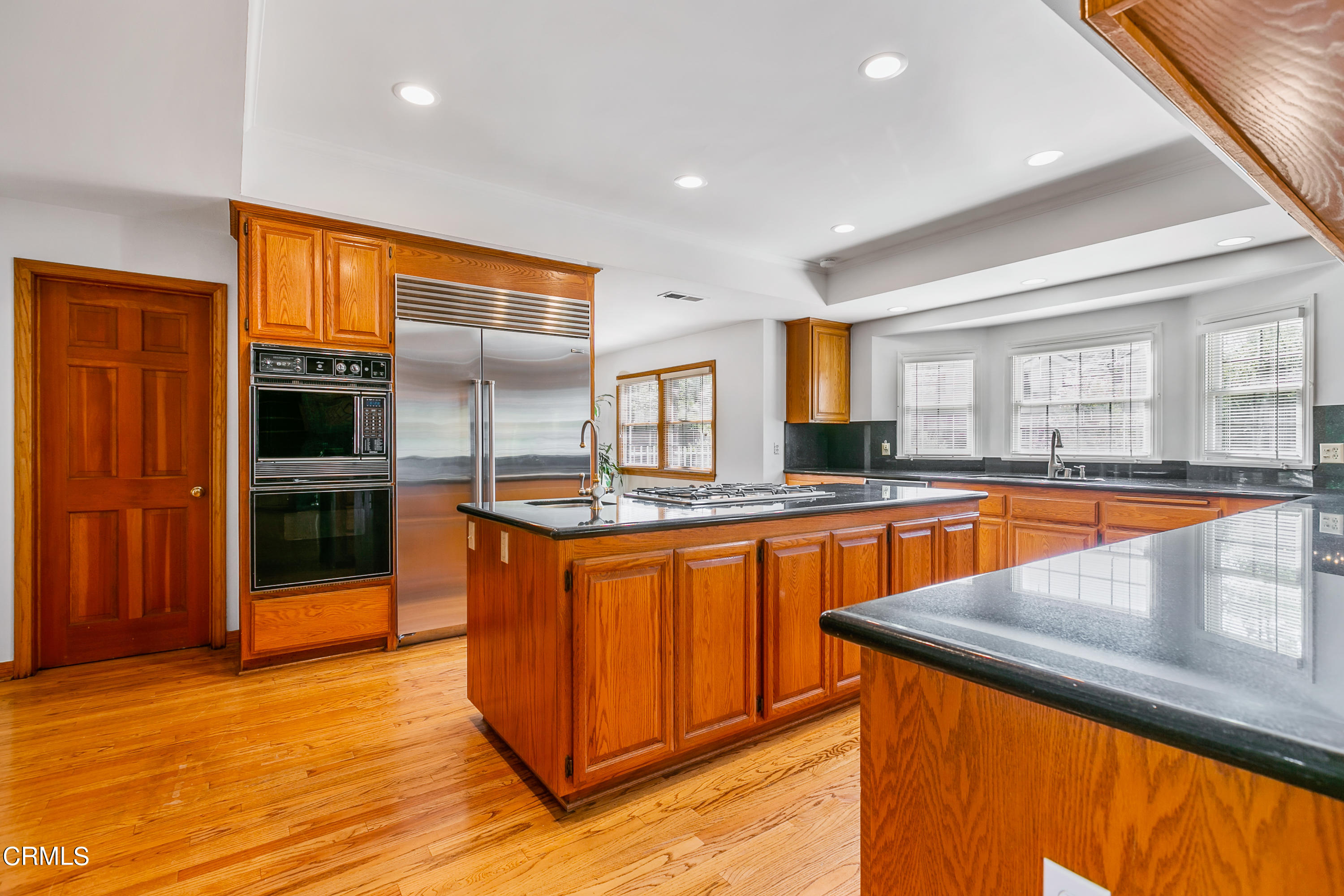 800 Greenridge Drive La Canada Flintridge, CA 91011 - Photo 14 of 58 a large kitchen with stainless steel appliances granite countertop a large counter top and a stove