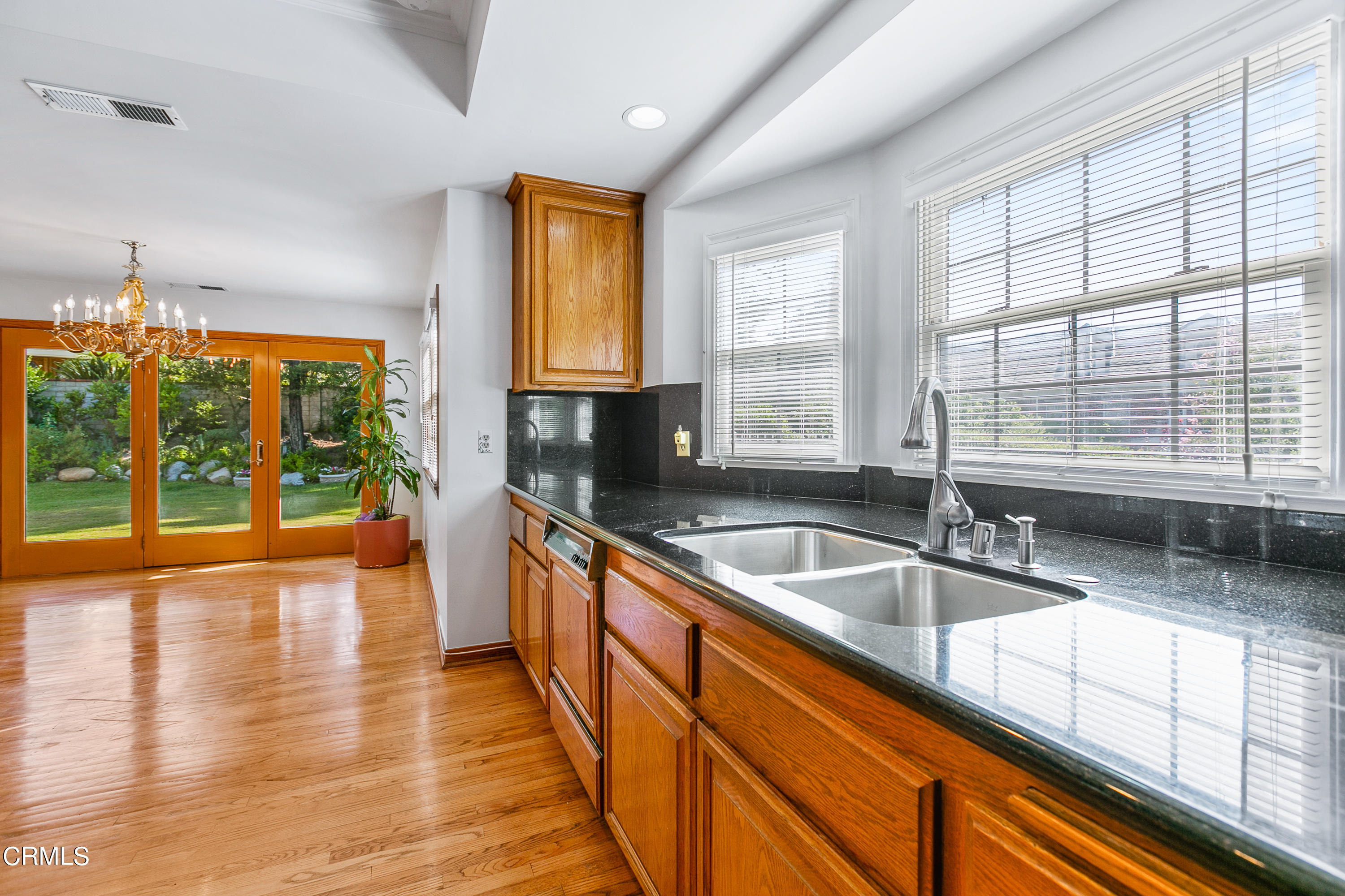 800 Greenridge Drive La Canada Flintridge, CA 91011 - Photo 15 of 58 a kitchen with stainless steel appliances granite countertop a sink and a large window